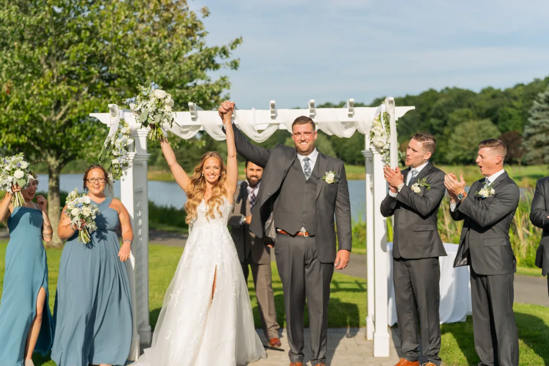 Newly married couple celebrating at an outdoor Long Island wedding